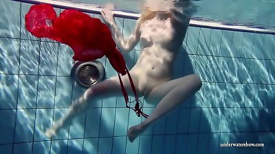Russian teenie Lucie heads underwater swimming