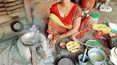 The was making roti and vegetables on a soft stove and signaled