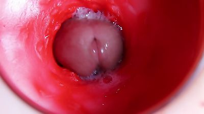 A huge salami inside a raw crevice pours out liquid and will shortly pack with milk