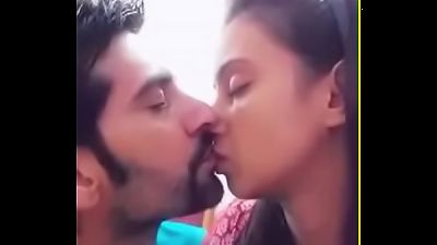 Indian newly married couple kiss